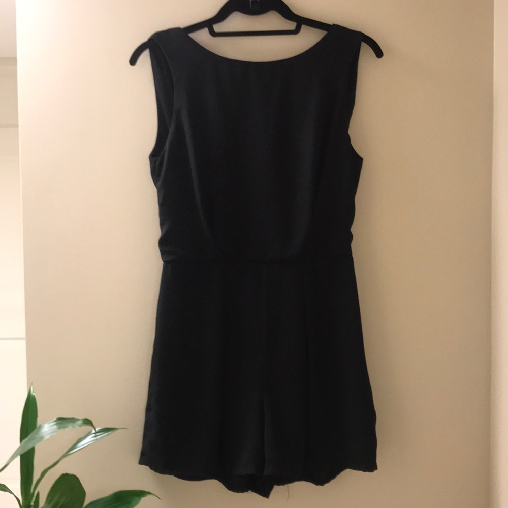 Ladies  prettyLace  back black romper.